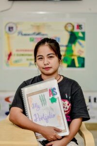 Woman Sitting with Portfolio